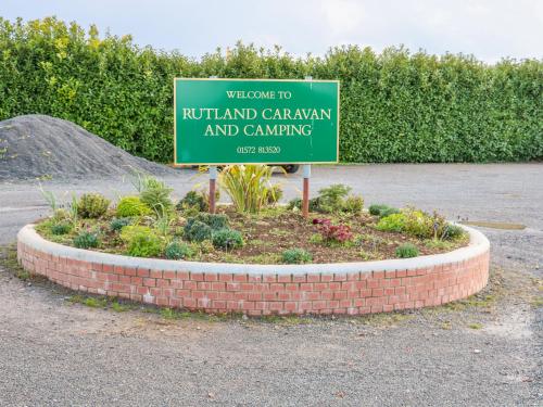 a sign for a rutherford garden and camping at Beech Lodge in Oakham