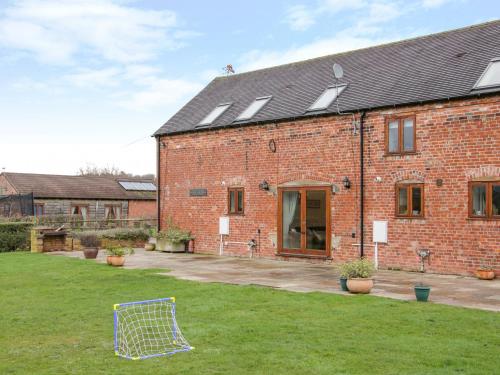 a brick house with a net in the yard at Southdown in Much Wenlock