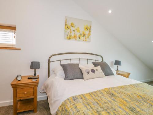 Postel nebo postele na pokoji v ubytování Coney Garth Cottage