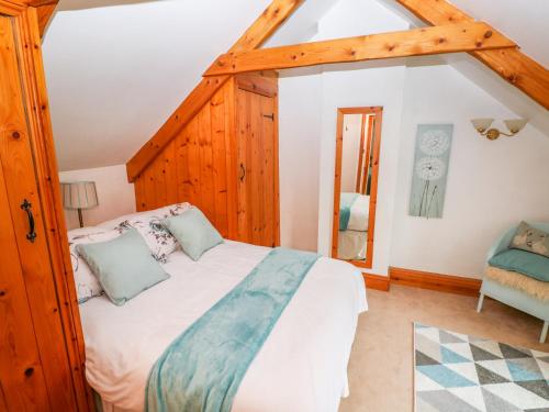 a bedroom with a large bed in a room at Cheriton Villa in Tenby