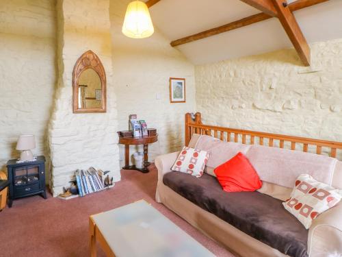 a living room with a couch and a wood stove at Beckelshele in Bishop Auckland