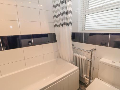 Et badeværelse på Cloverleaf Cottage