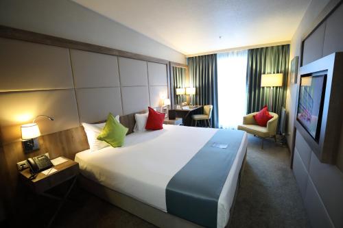 Ένα ή περισσότερα κρεβάτια σε δωμάτιο στο ibis Styles Istanbul Bomonti