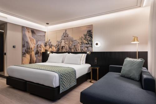 A bed or beds in a room at Eurostars Ambassador