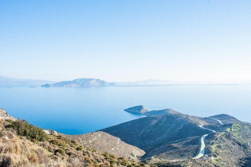 a view of the ocean from the top of a mountain at Anthoula's House in Psathi