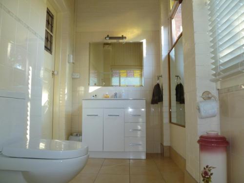 a bathroom with a tub and a sink and a toilet at Donalea Bed and Breakfast & Riverview Apartment in Castle Forbes Bay