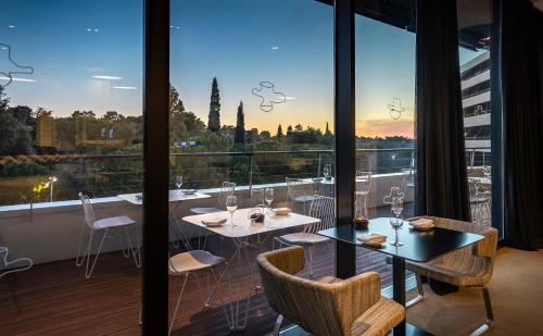 a dining room with a view of the city at Lone Hotel by Maistra Collection in Rovinj