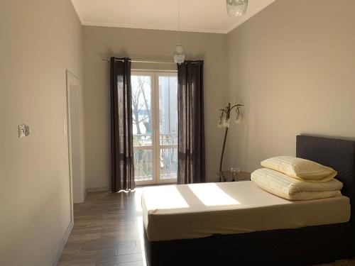 Posteľ alebo postele v izbe v ubytovaní Apartamenty Nadjeziorna