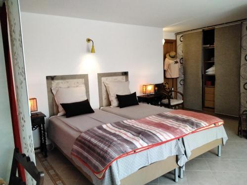a bedroom with a large bed in a room at Manta Rota Beach, apartment in a villa, terrace,garden in Manta Rota