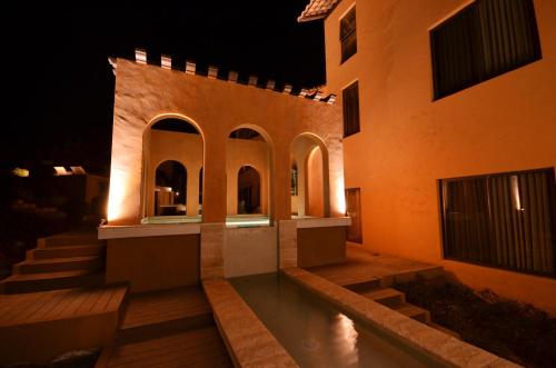 an external view of a building at night at Toscana Hotel La Casetta in Mu Si