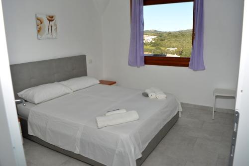 Кровать или кровати в номере Residence Eolo