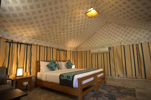 Una cama o camas en una habitación de The Golden Tusk By Ivory Destinations