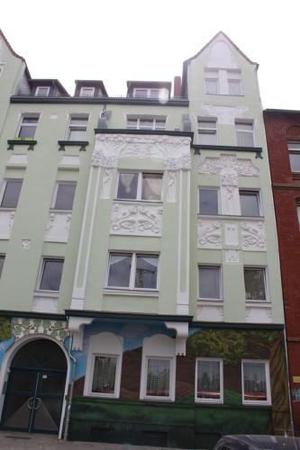 an apartment building on the corner of a street at Oktopus in Hannover