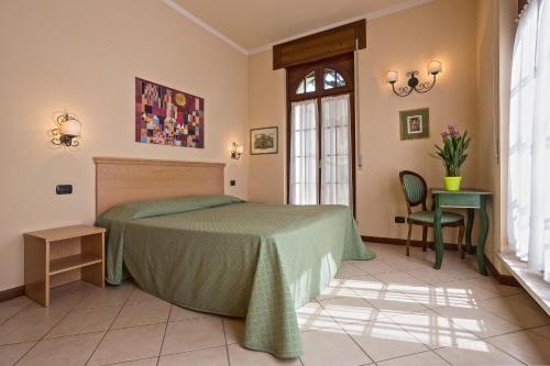 Ένα ή περισσότερα κρεβάτια σε δωμάτιο στο Residence Villa Mainard