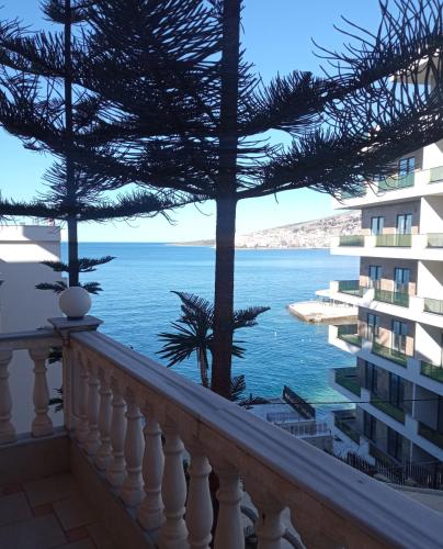 a view from the balcony of a condo overlooking the ocean at Apartments Romario in Sarandë