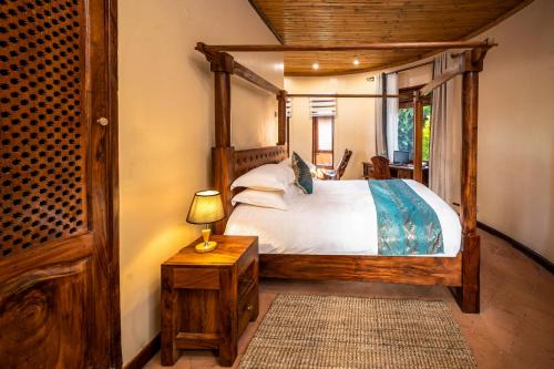 Giường trong phòng chung tại Divine Resort & Spa
