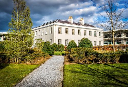 a large white building with a pathway in front of it at Radisson Blu Hotel, Cork in Cork
