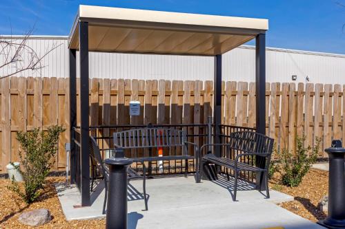 a gazebo with two chairs under it at Comfort Inn Jonesboro in Jonesboro
