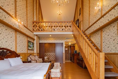 Postel nebo postele na pokoji v ubytování Cingjing Florence Resort Villa