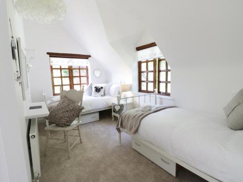 Katil atau katil-katil dalam bilik di Hillview Cottage