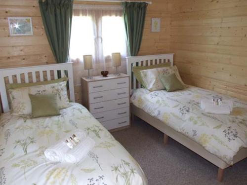 Ένα ή περισσότερα κρεβάτια σε δωμάτιο στο Pennylands Willow Lodge