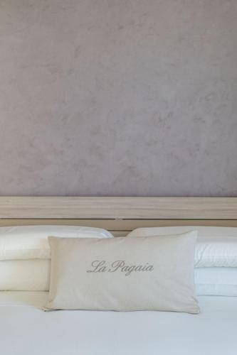 a white pillow sitting on top of a bed at Villa La Pagaia Sorrento Coast in Vico Equense