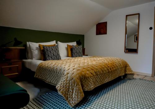 a bedroom with a large bed and a mirror at St Anton 365 in Sankt Anton am Arlberg
