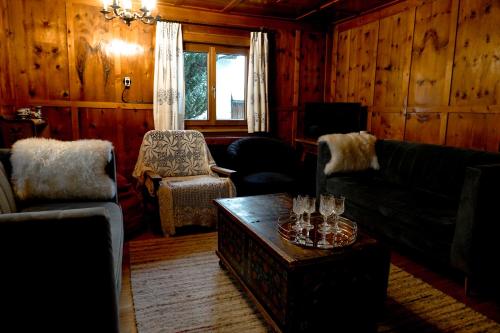 a living room with a couch and a table at St Anton 365 in Sankt Anton am Arlberg