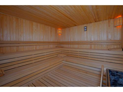 an empty sauna with wood paneling and a wooden ceiling at Limak Cyprus Deluxe Hotel in Iskele