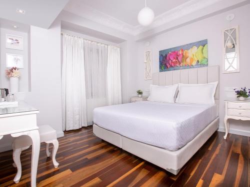 Ένα ή περισσότερα κρεβάτια σε δωμάτιο στο Ascot Hotel Büyükada