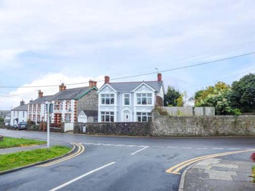 a street with houses on the side of the road at Pen Hill in Llantwit Major
