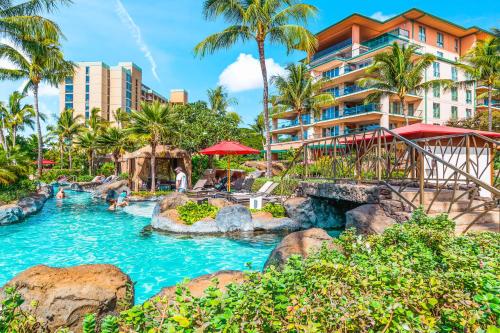 a pool at the resort with people in it at Honua Kai - Hokulani 110 - 2 Bed 2 Bath Apartment in Honua Kai Resort in Lahaina