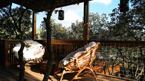a porch with a bench and a tree at Villa Occitana in Calvisson