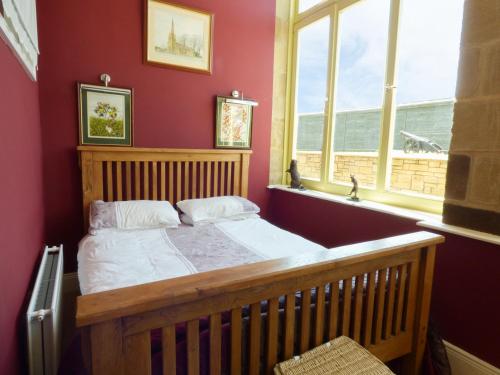 En eller flere senge i et værelse på Humbleton Cottage