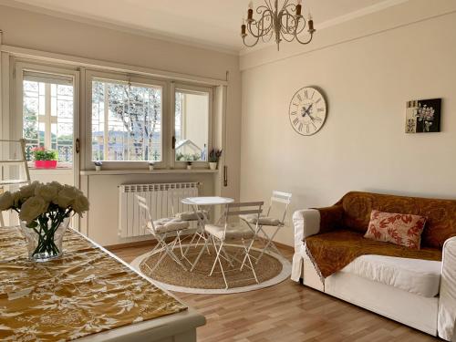 a living room with a couch and a table at B&B EurGardenie in Rome