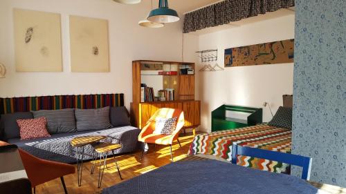 a living room with a couch and a table at STUDIO KLIMAT PRAGA in Warsaw