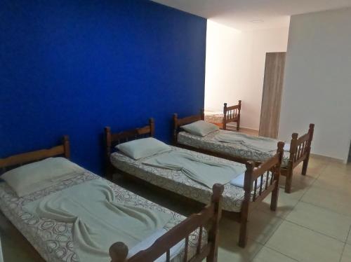 En eller flere senge i et værelse på Hotel Mão de Fatima