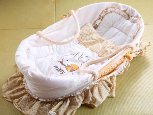 a baby basket with a hello kitty baby blanket at Hatsuneso Shinkan in Ureshino