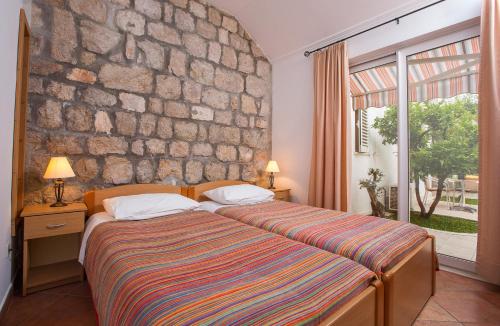 Postel nebo postele na pokoji v ubytování Apartments Benussi
