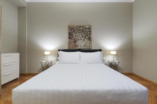 Un pat sau paturi într-o cameră la Contempora Apartments - Cavallotti 13 - B23