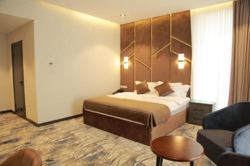 Ένα ή περισσότερα κρεβάτια σε δωμάτιο στο UNIQUE HOTEL