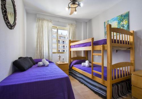 Posteľ alebo postele v izbe v ubytovaní Apartamentos Mare Nostrum 8-5º-E