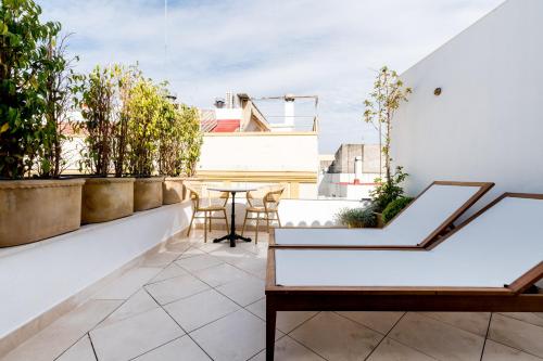 En balkon eller terrasse på Casa Bailen Sevilla