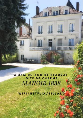 a house with a sign in front of it at Manoir 1838 à - 3 km du Zoo de Beauval & proche des châteaux in Saint-Aignan