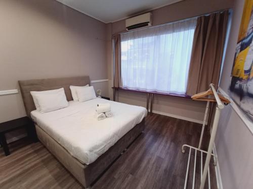 Llit o llits en una habitació de Ermou & Athinas Suites in Monastiraki