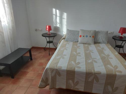 Posteľ alebo postele v izbe v ubytovaní CASA LA ABUELA REMEDIOS