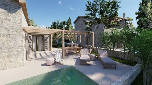 a patio with chairs and a table and a swimming pool at PAPADRIA VILLAS - Modern Luxury villas near Kathisma Beach in Tsoukaladhes
