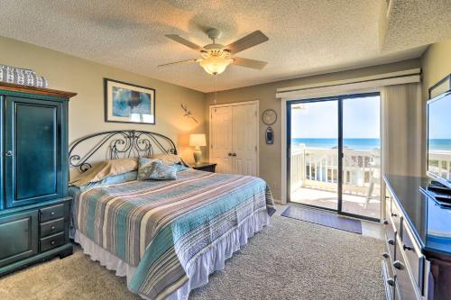 a bedroom with a bed and a ceiling fan at Coastal Condo with Indoor and Outdoor Pool Access in Emerald Isle