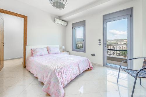 Ένα ή περισσότερα κρεβάτια σε δωμάτιο στο Villa Alexandros