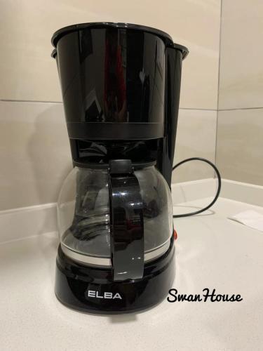 a black coffee maker sitting on top of a counter at Premium Swanhouse no.SiX with 3bedrooms Condo in Sibu